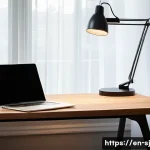 Home 19 홈 오피스 공간을 위한 최적의 조명 선택 - A modern home office setup featuring a sleek minimalist metal desk lamp with adjustable arms and dim...